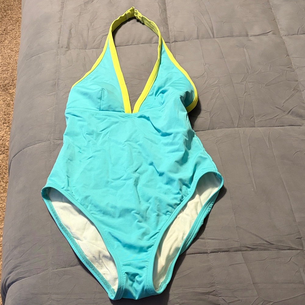 Never worn one piece swim suit. Medium